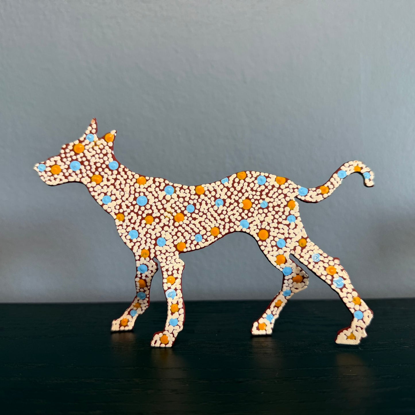 Steel Dog Artwork: Stinky 2, brown base, white dots with blue and orange dotted highlights
